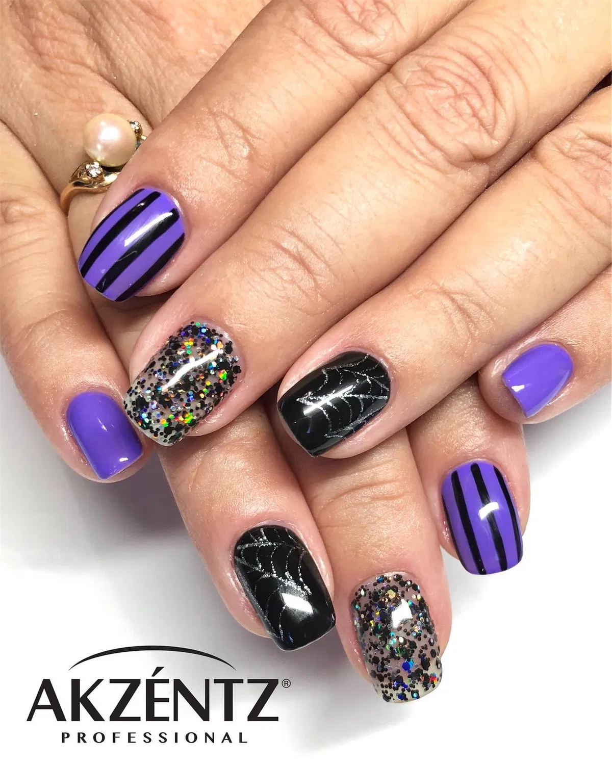 Purple stripes, black webs, and multicolor glitter mix