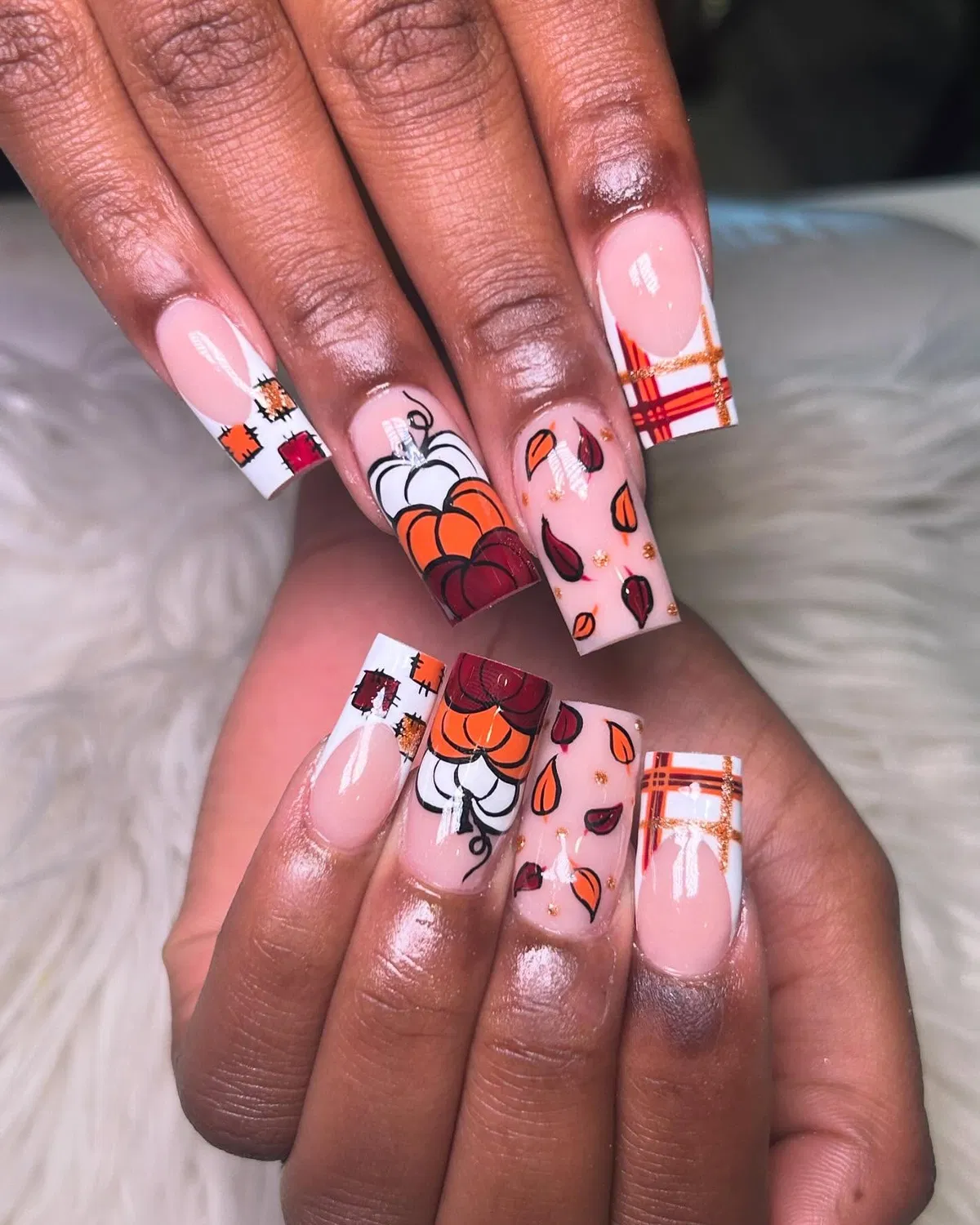 Pink base with pumpkins, leaves, and plaid lines