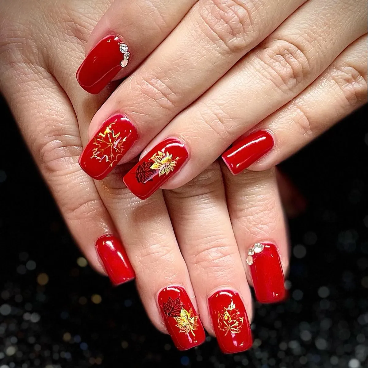 Glossy bright red with gold leaf art and gems