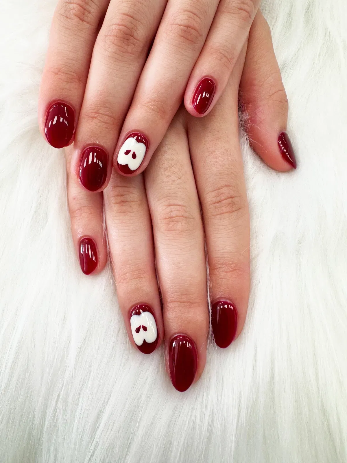 Deep burgundy with white apple accents