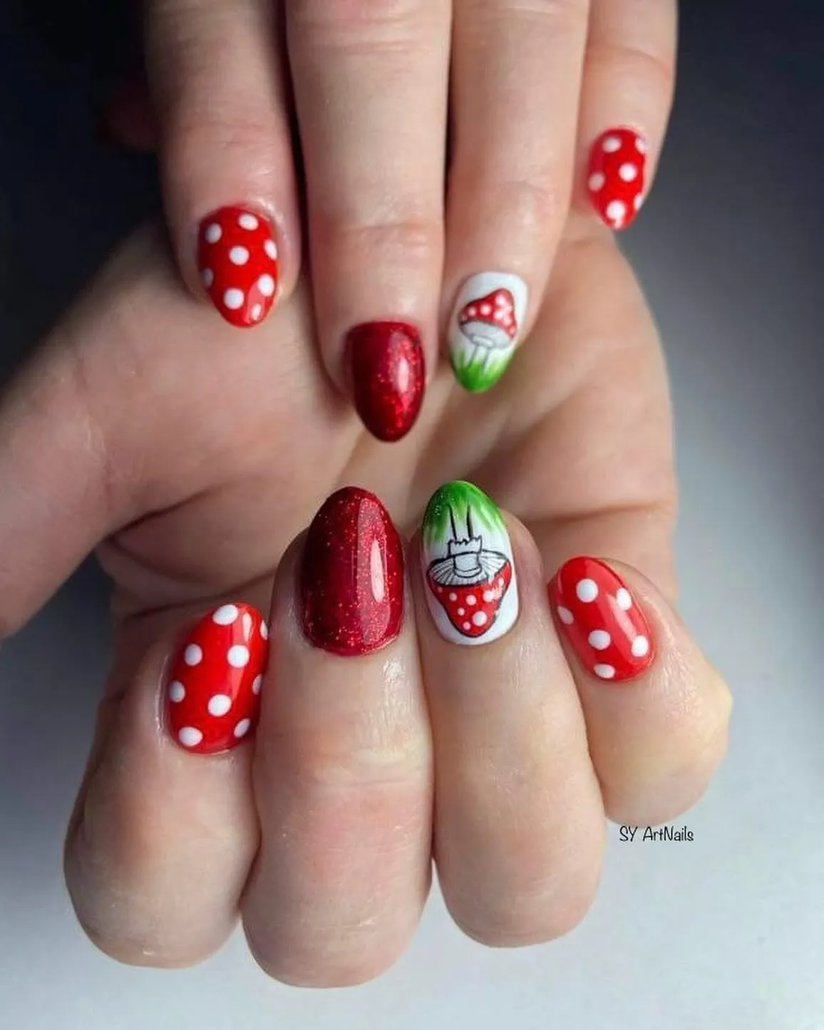 Red polka dots with mushroom accent nails