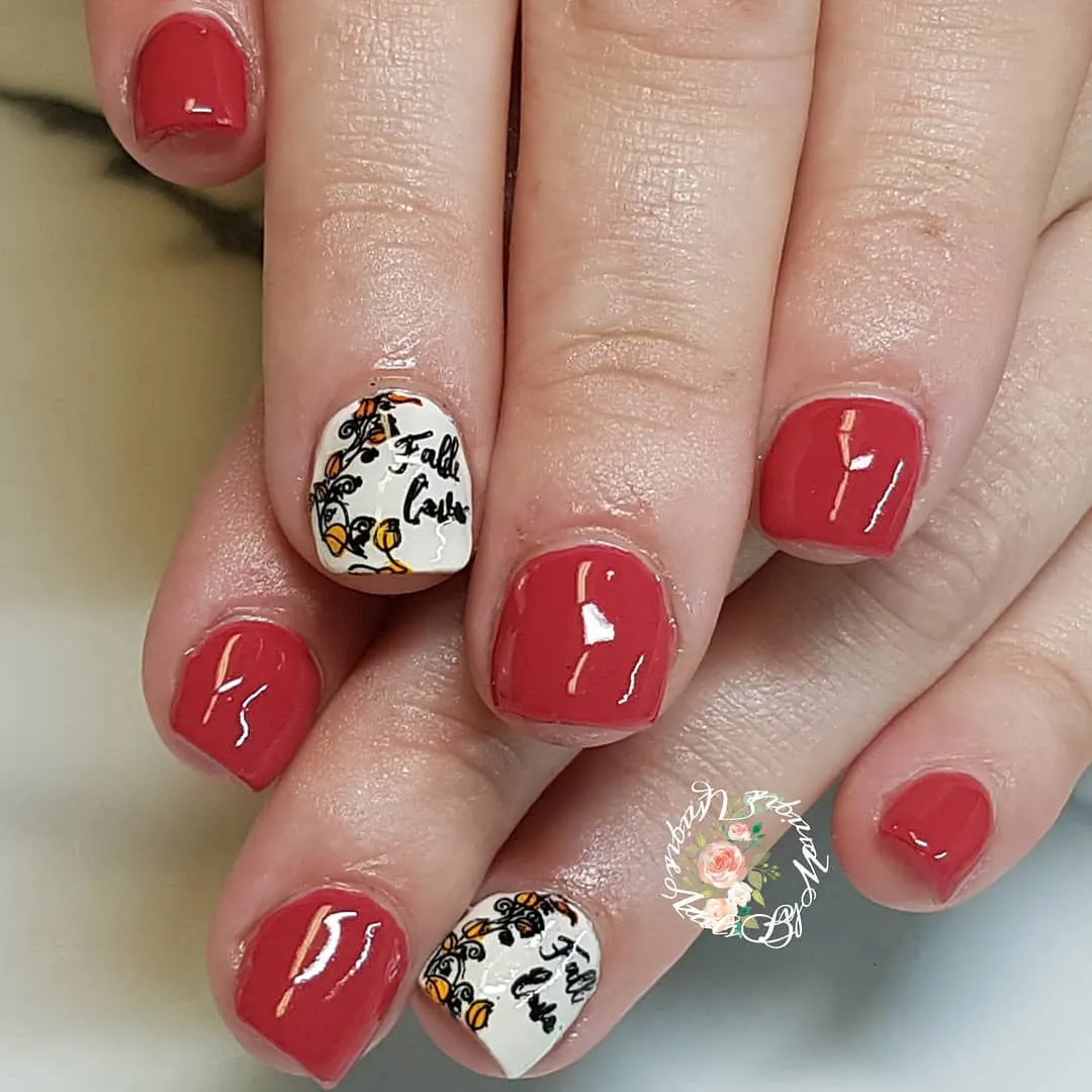Muted red with white text accent nails