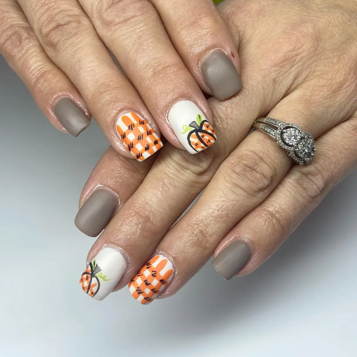 Matte taupe and white with pumpkin and check accents