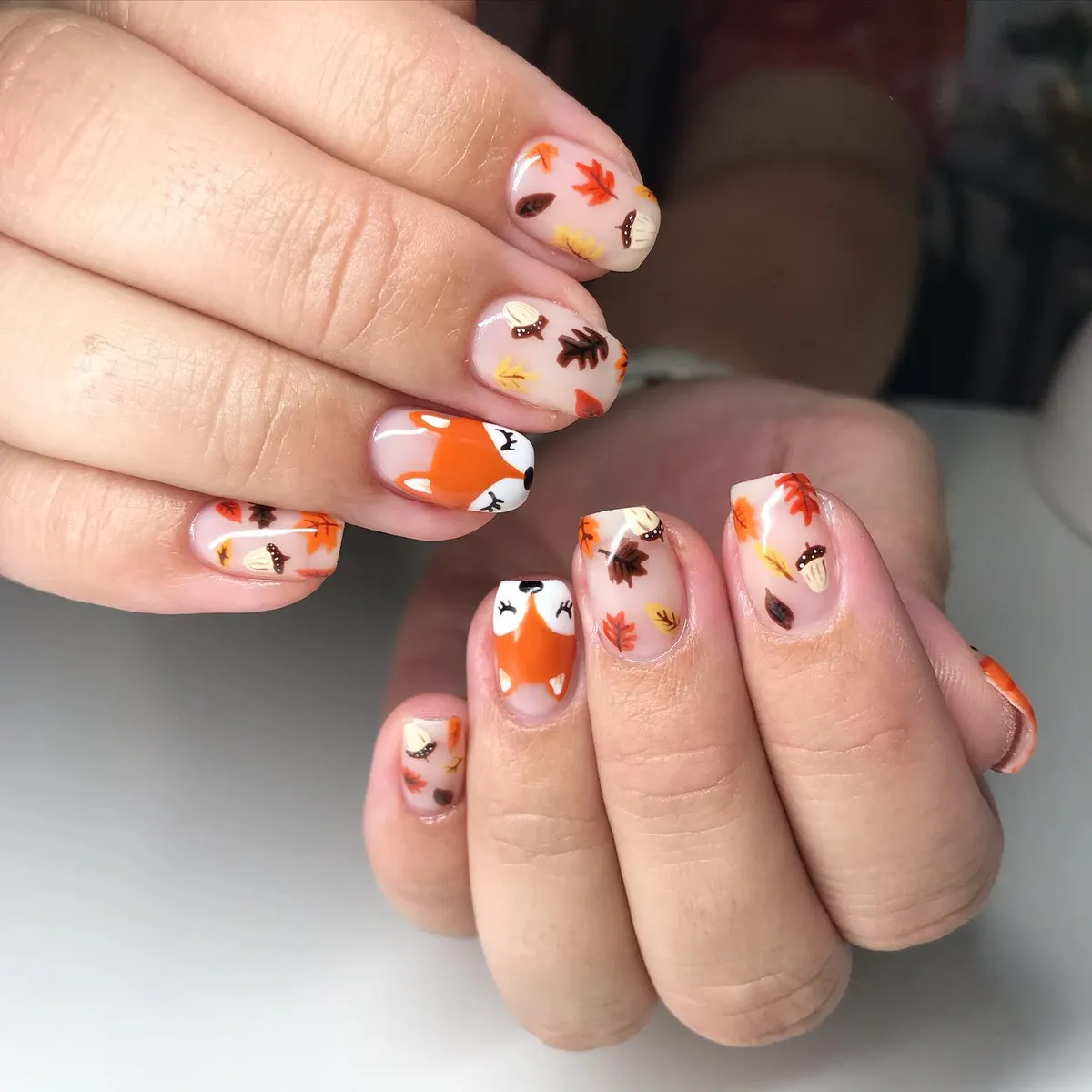 Sheer pink base with leaves, mushrooms, and fox faces