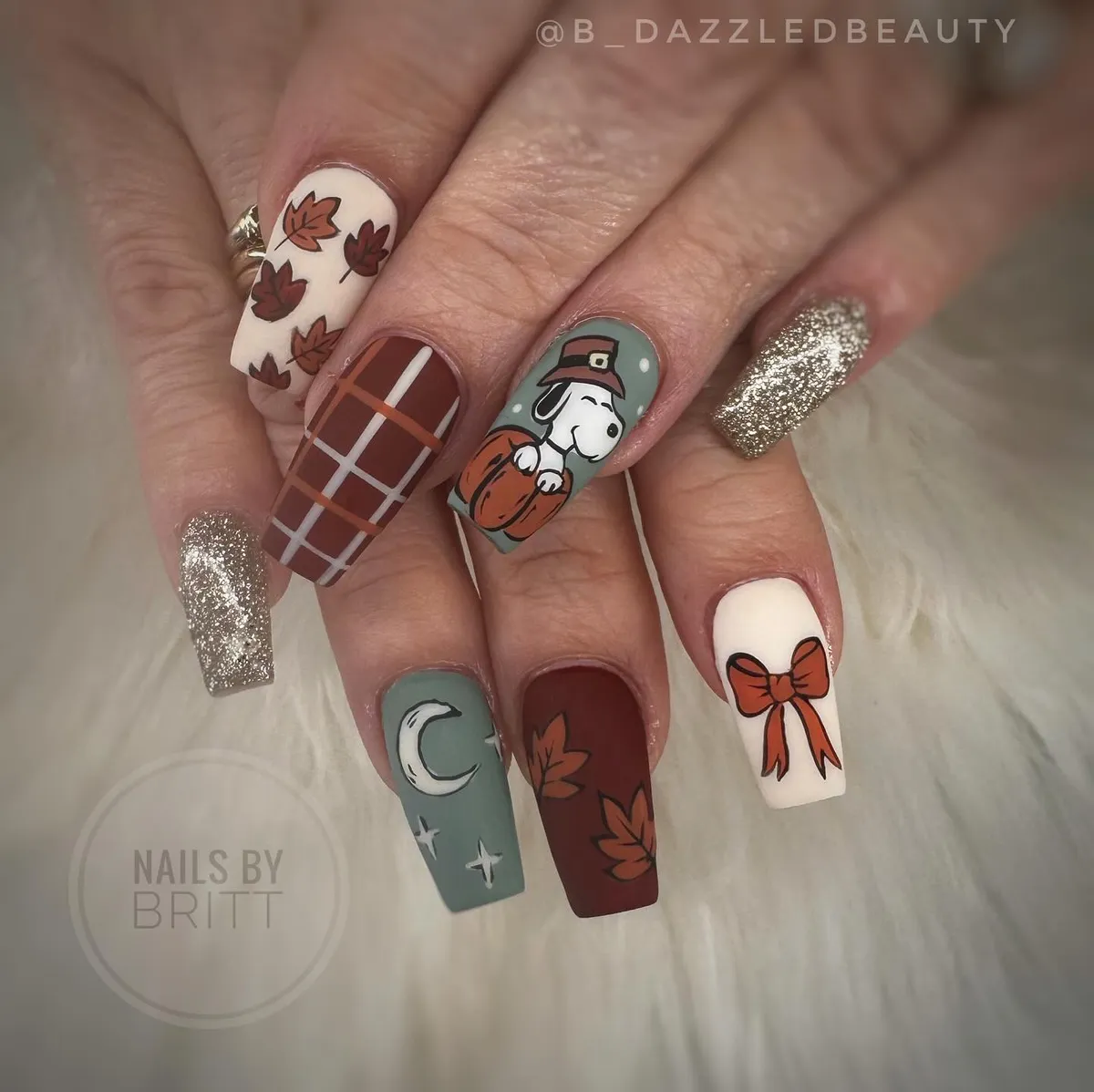 Coffin nails with plaid, leaves, gold sparkle, and pumpkin cartoon accent