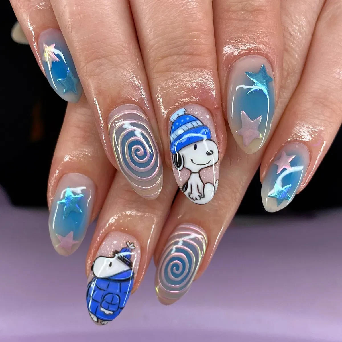 Blue star gradients with cartoon character accents