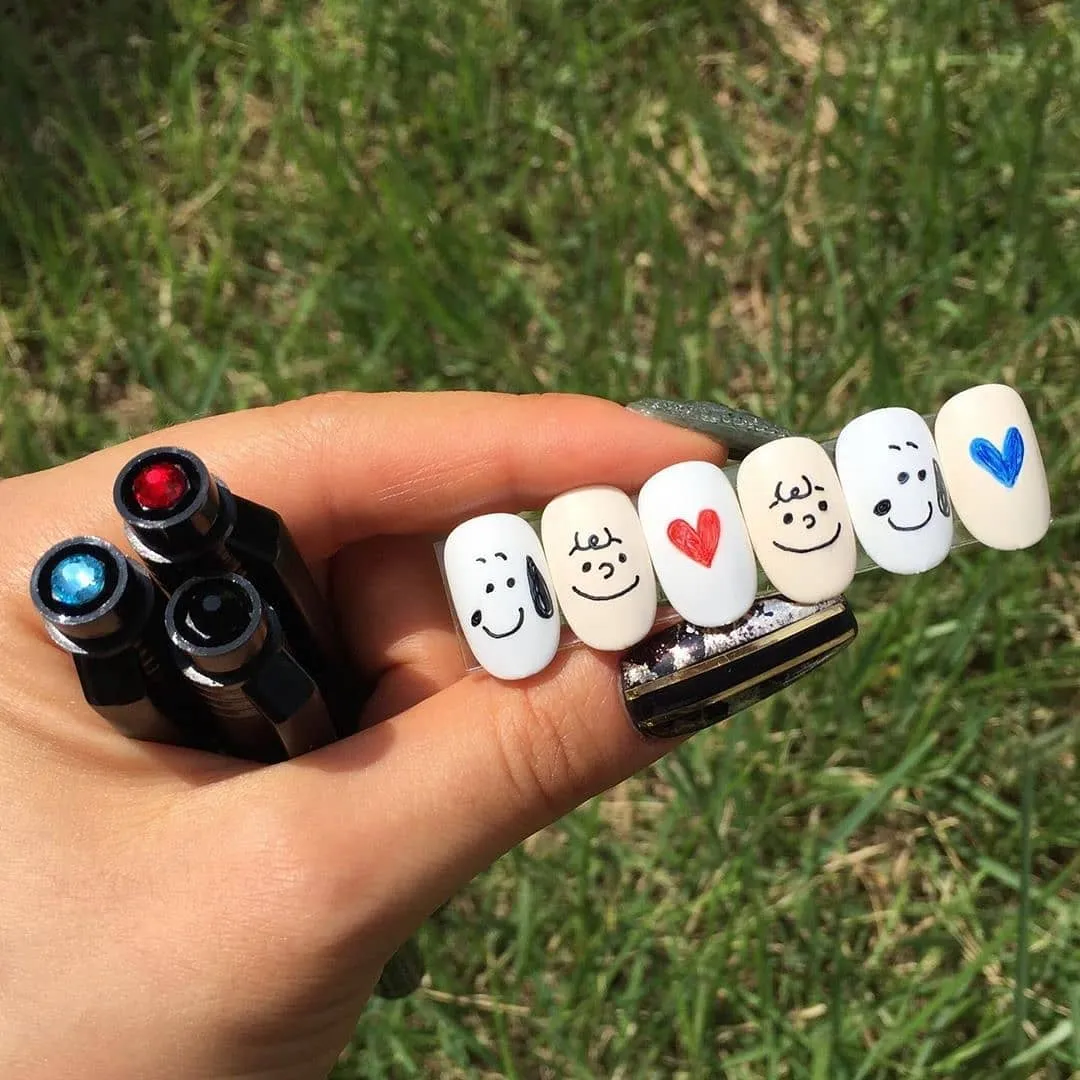 Minimal white tips with face line art and hearts