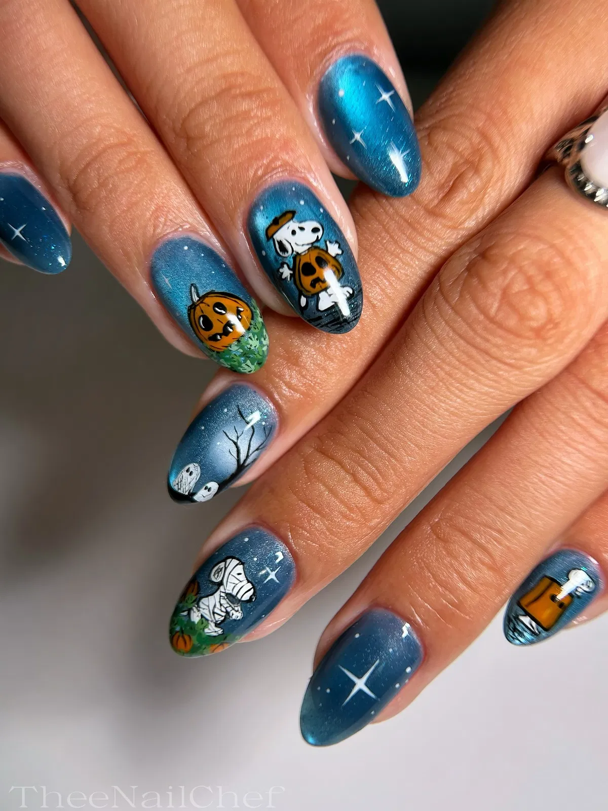 Blue metallic night-sky set with pumpkins and spooky character motifs