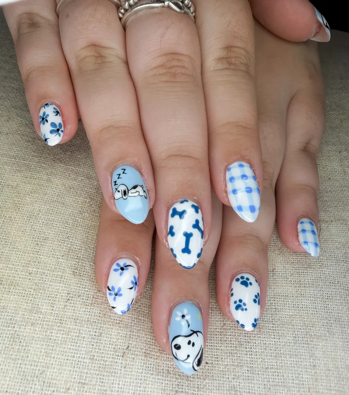 Blue-and-white mix: gingham, bones, paw prints, and cartoon dog details