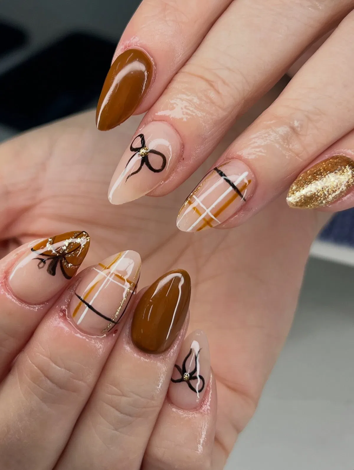 Nude and brown plaid with black bows and gold glitter