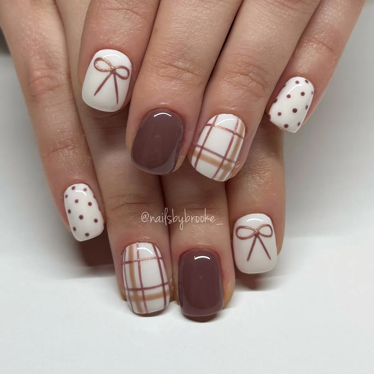 Taupe solids with white bows, plaid, and polka dots