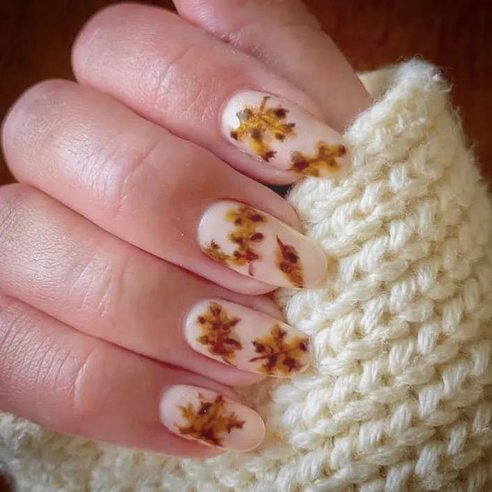 Off-white nails with brown leaf pattern