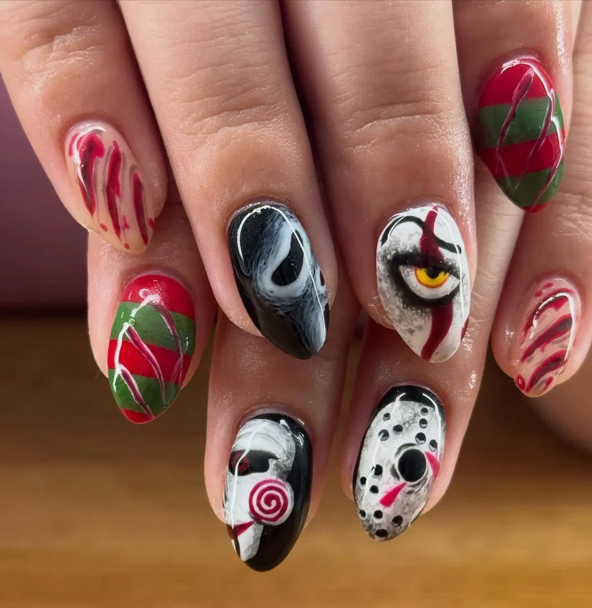Mixed horror-inspired faces with stripes and mask motif