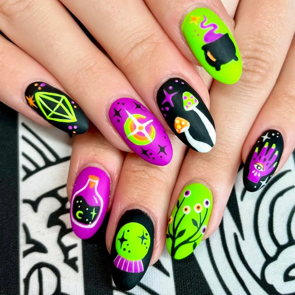 Neon witchy icons on almond nails