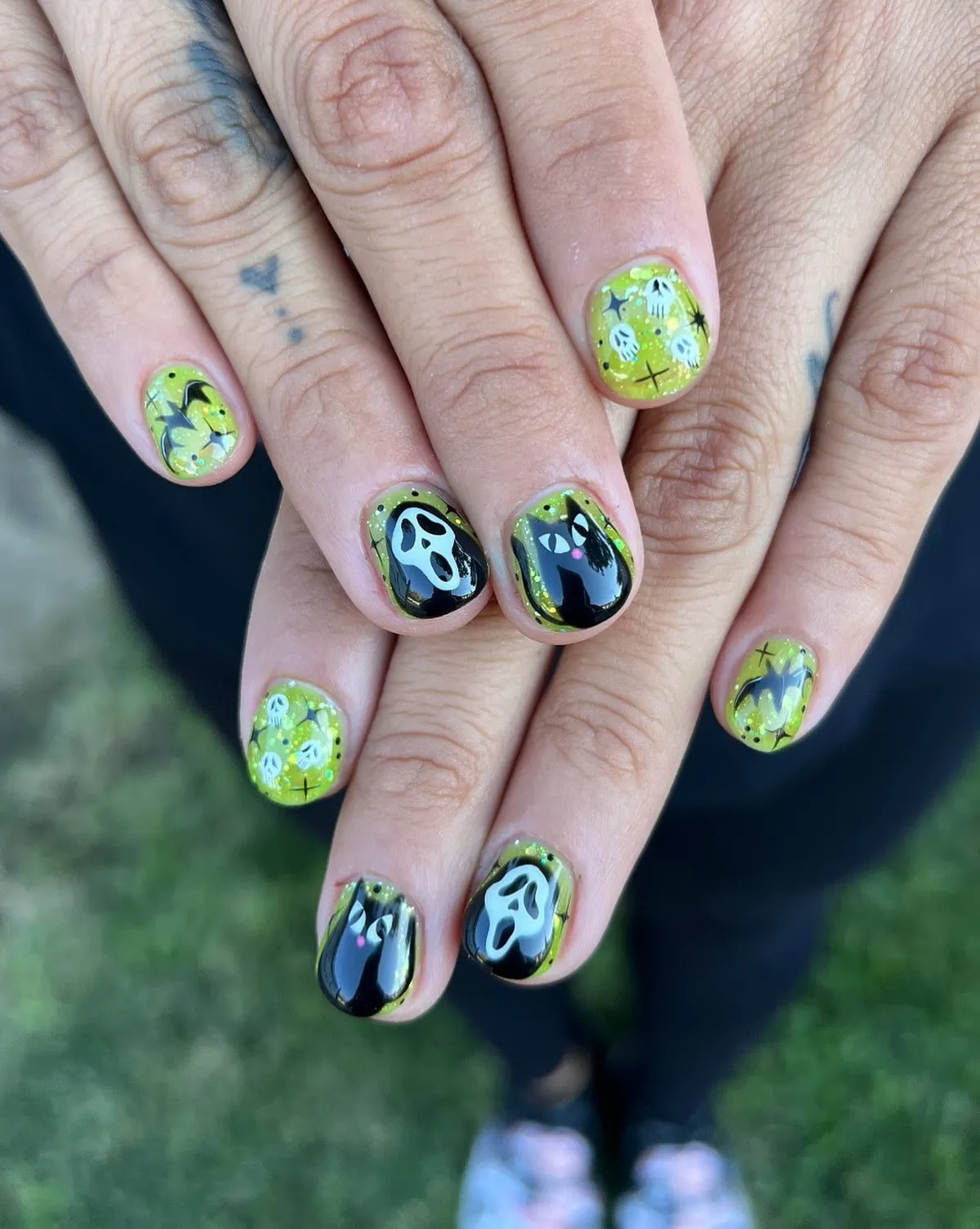 Yellow-green ghosts with black-and-white face accents