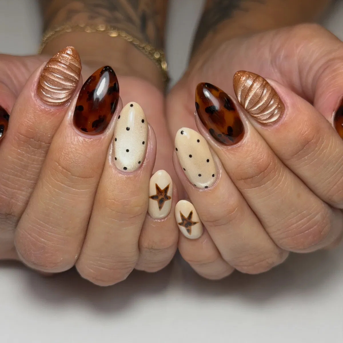 Tortoiseshell accents with polka dots and ridged metallics