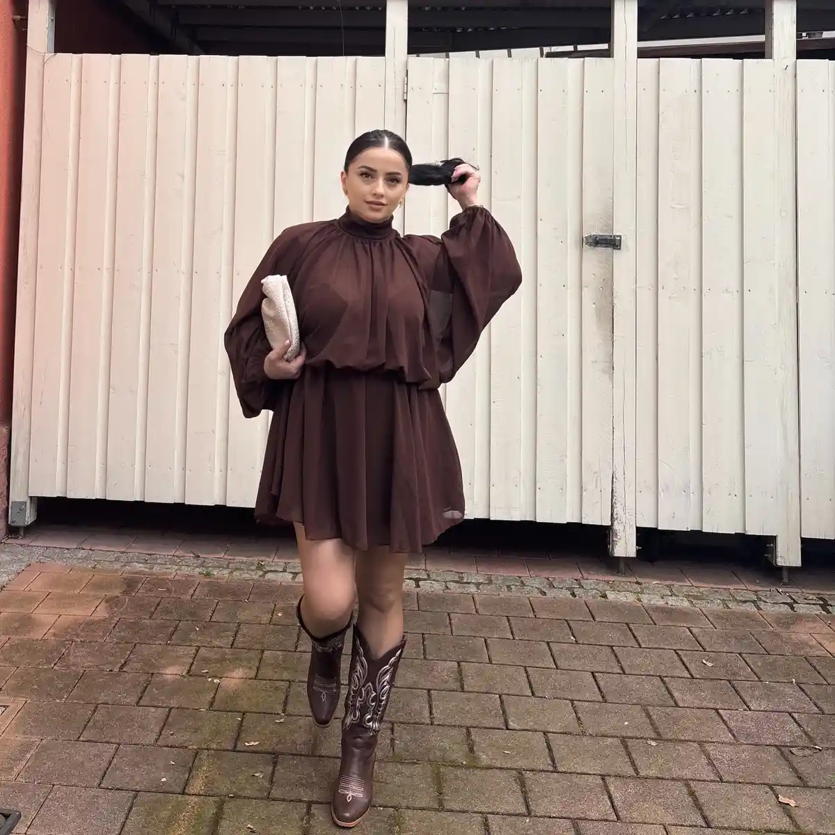 Brown mini dress with stitched knee-high boots