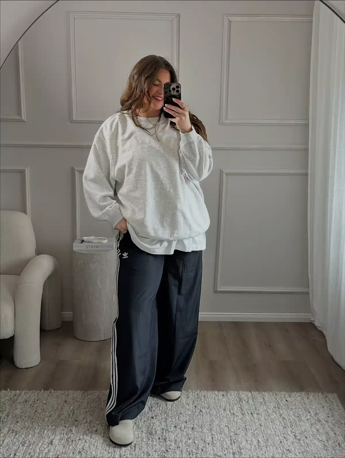 Oversized gray sweatshirt with striped track pants