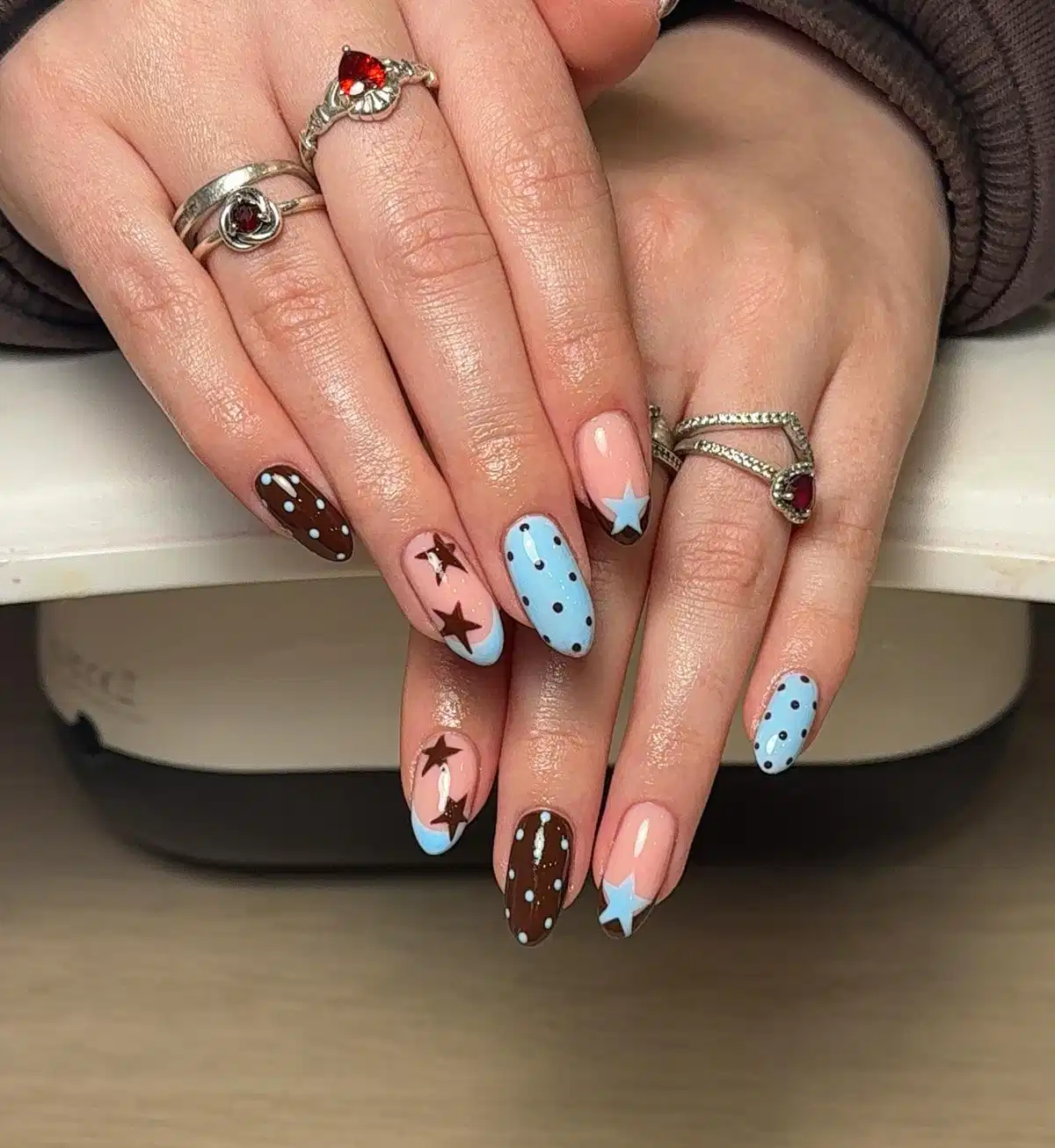 Stars and polka dots in blue, brown, and nude pink