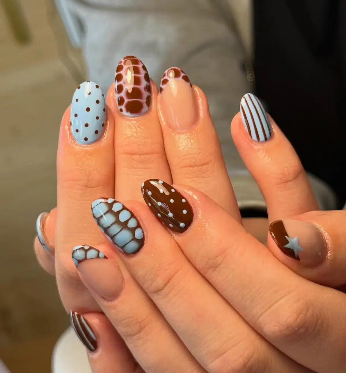 Mixed patterns: polka dots, stripes, and brown spot-like patches