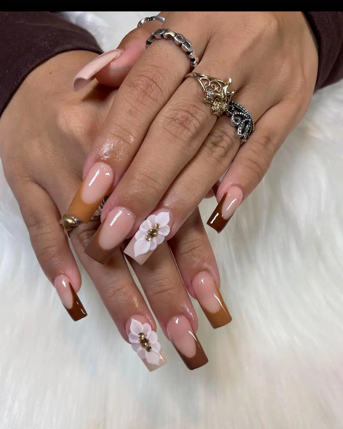 Brown French-tip coffins with white 3D flowers
