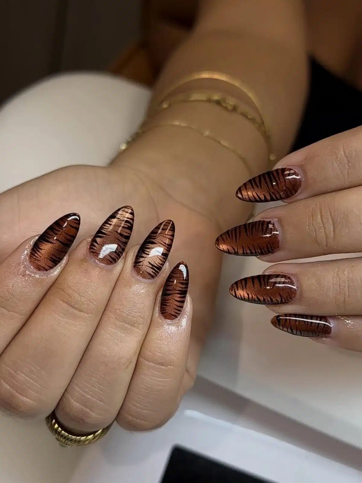 Brown striped almond nails