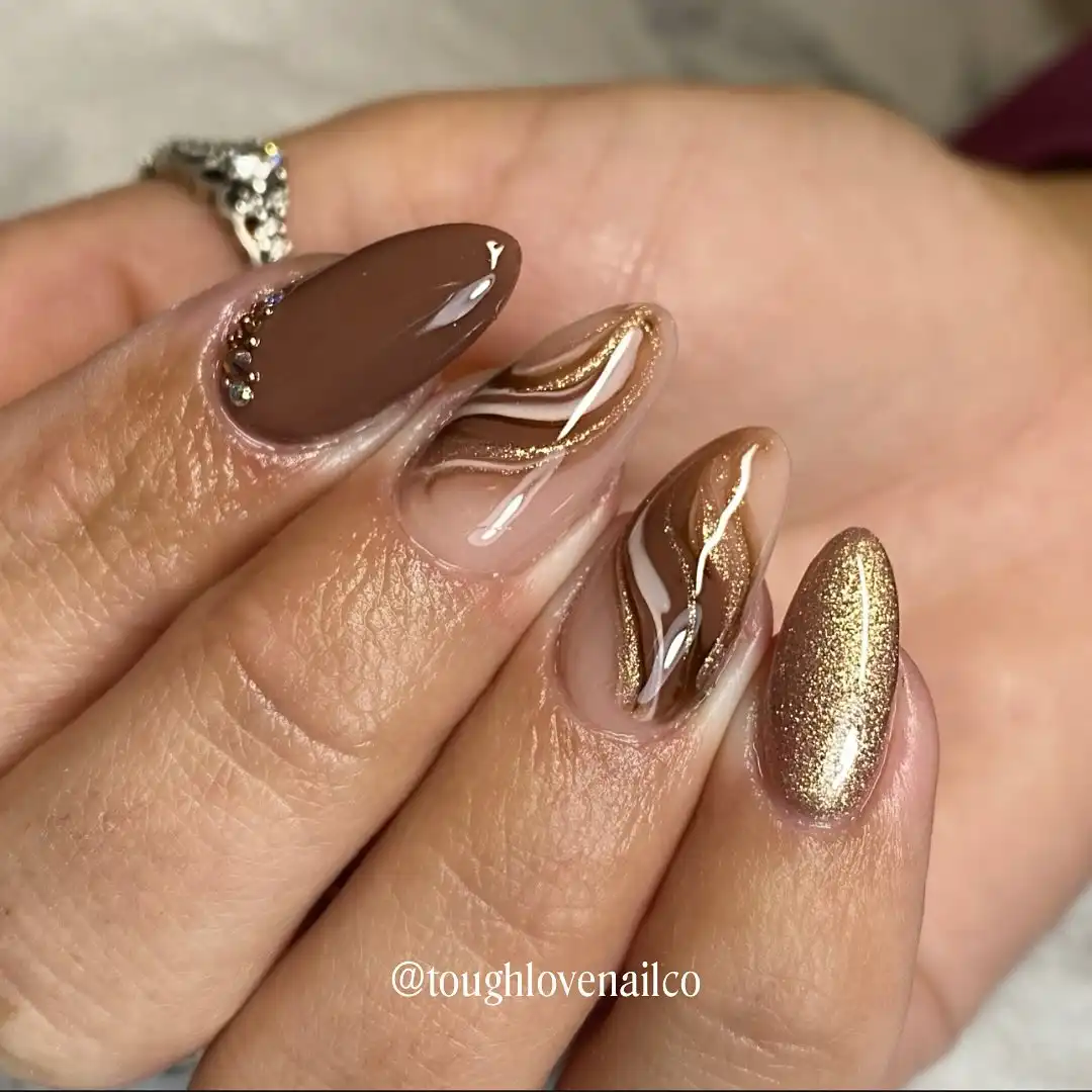 Brown, nude, and gold wavy-line mix with a gold shimmer accent