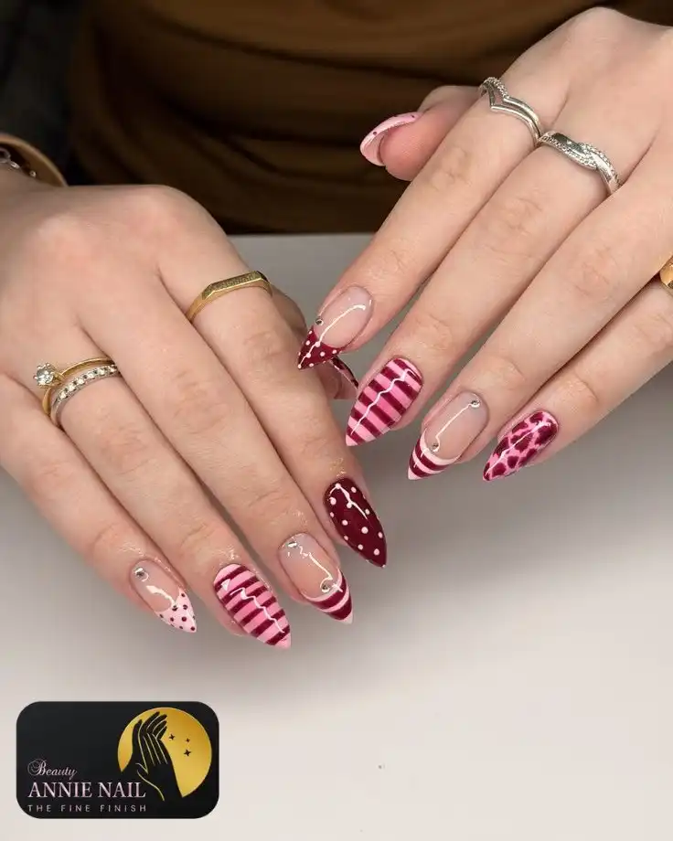 Nude, pink stripes, and deep red dotted accents with visible logo
