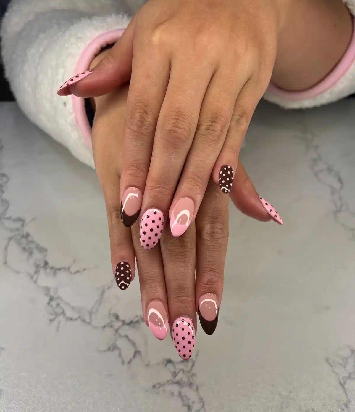 Long almond set with brown tips, hearts, and polka dots