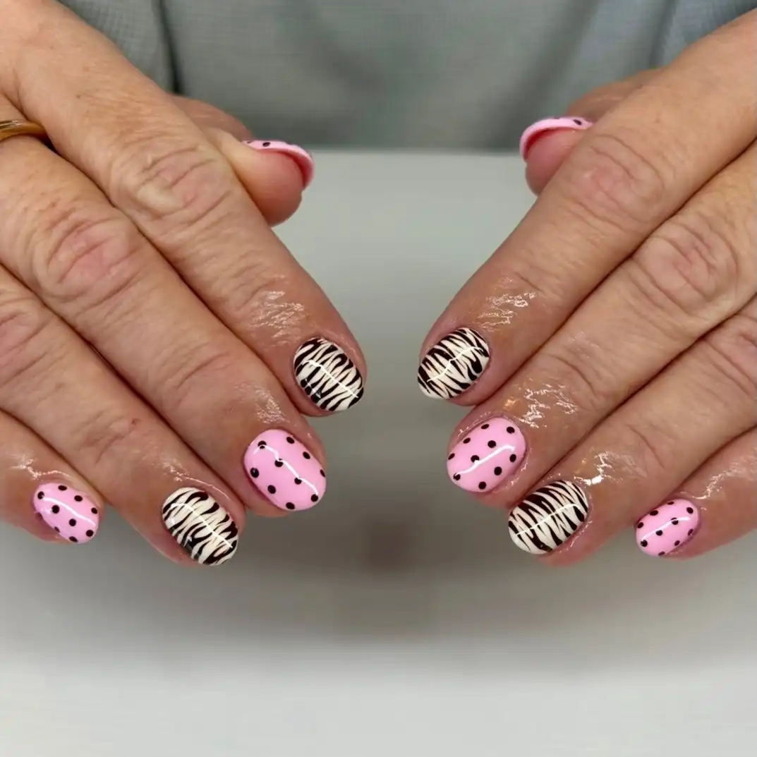 Pink polka dots with black-and-white stripe accents