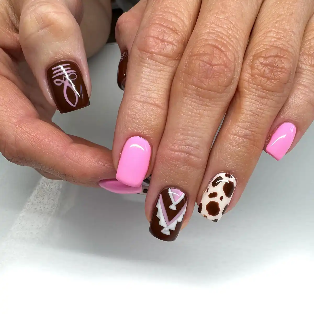 Light pink and dark brown with graphic and spotted accents