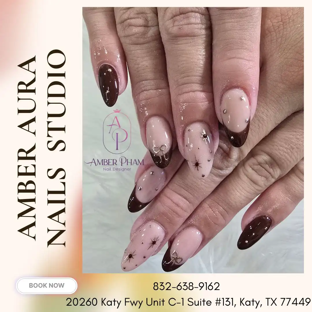 Dark-brown French tips with rhinestone studs and starburst motifs