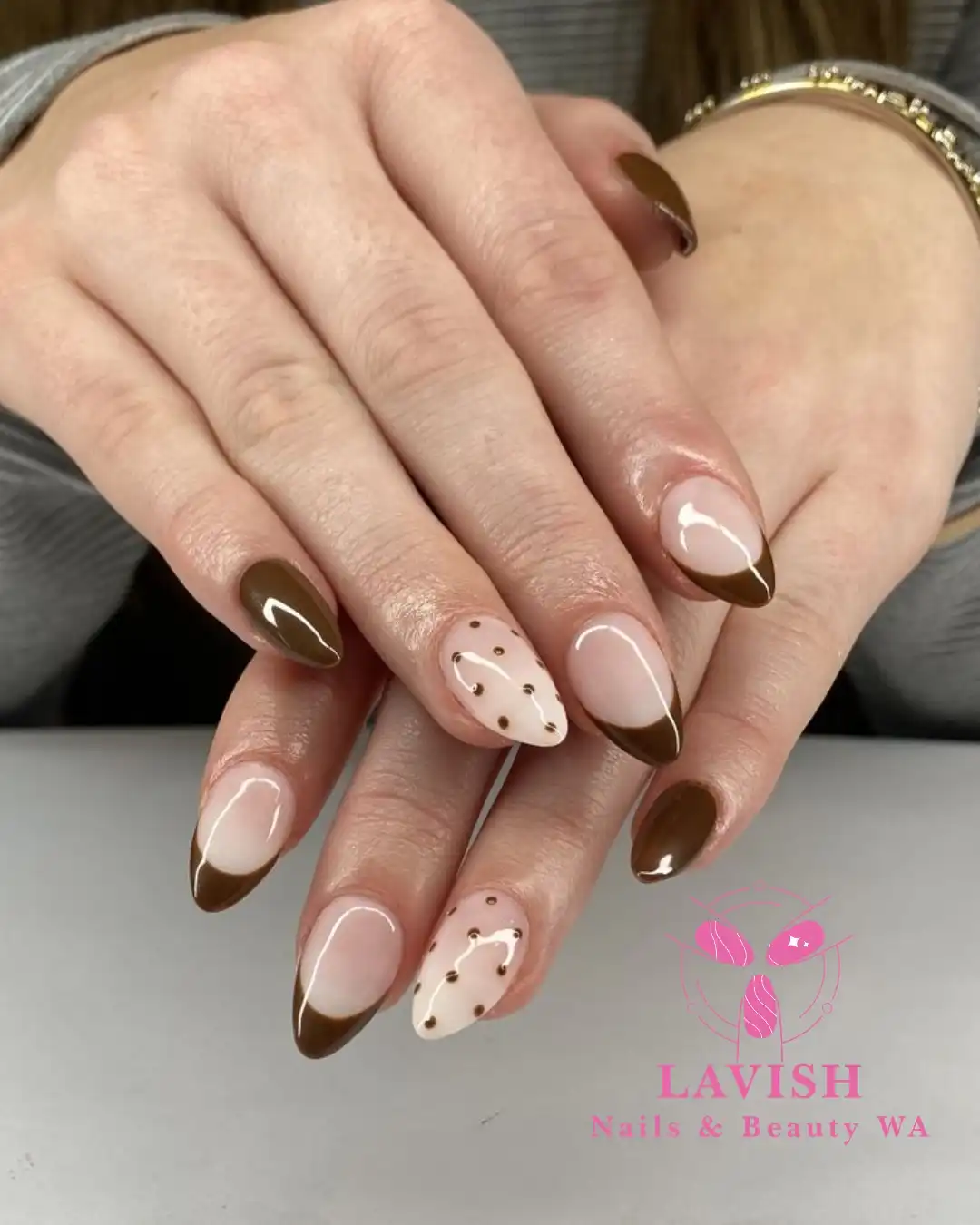 Olive-brown French tips with minimal dotted accents