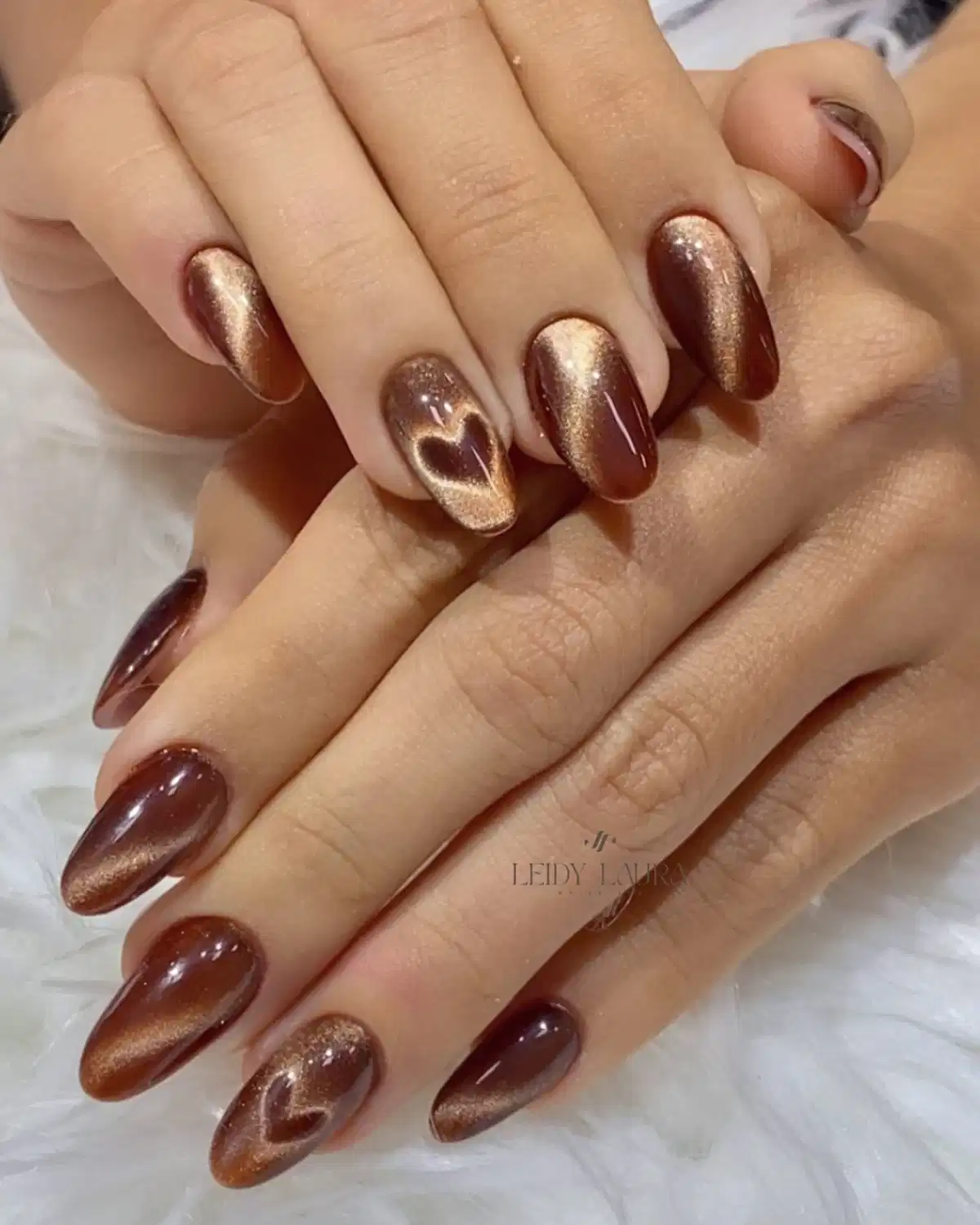 Metallic brown cat-eye style with heart accents