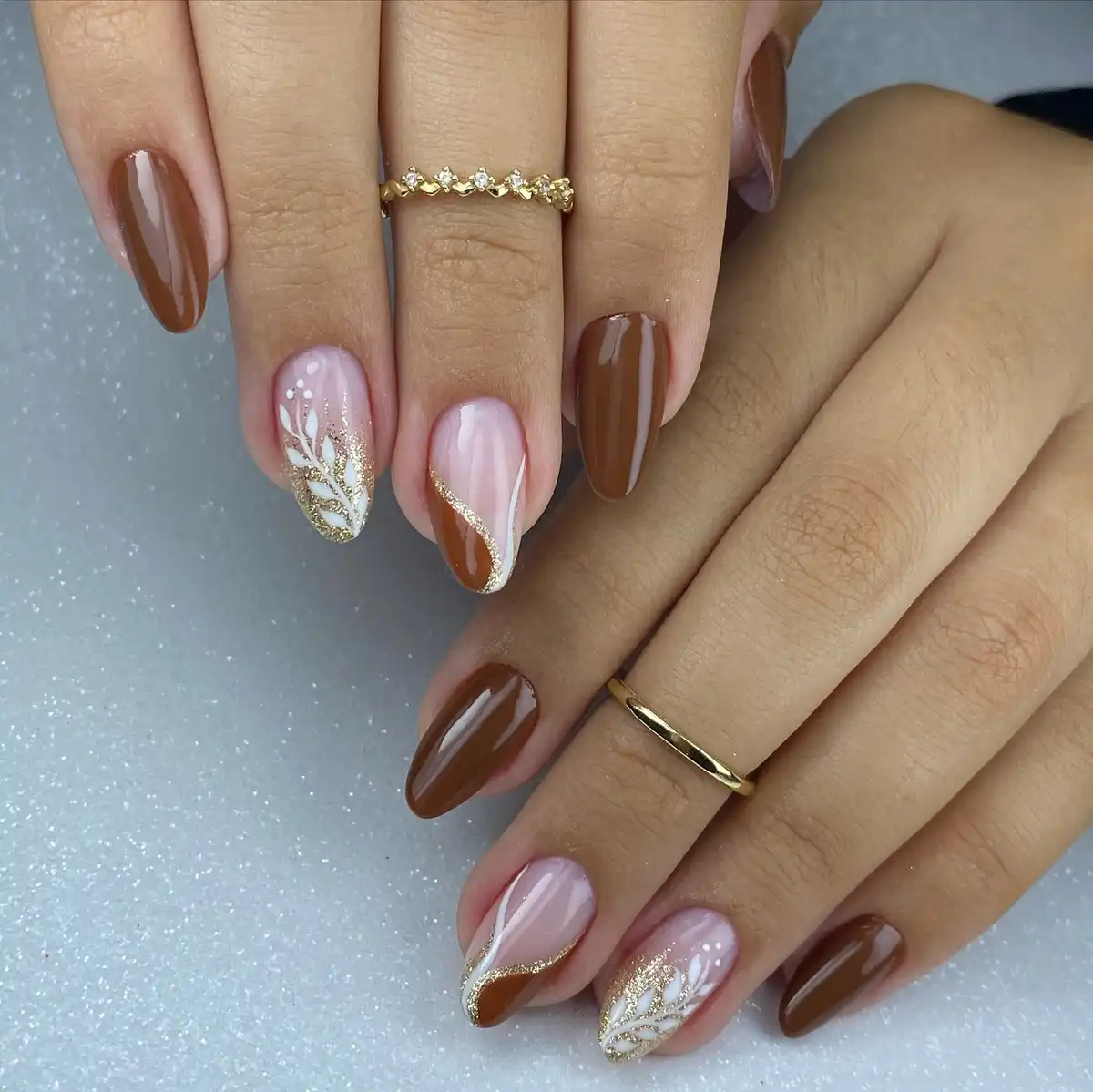 Brown and nude mix with gold curves and white leaf accents