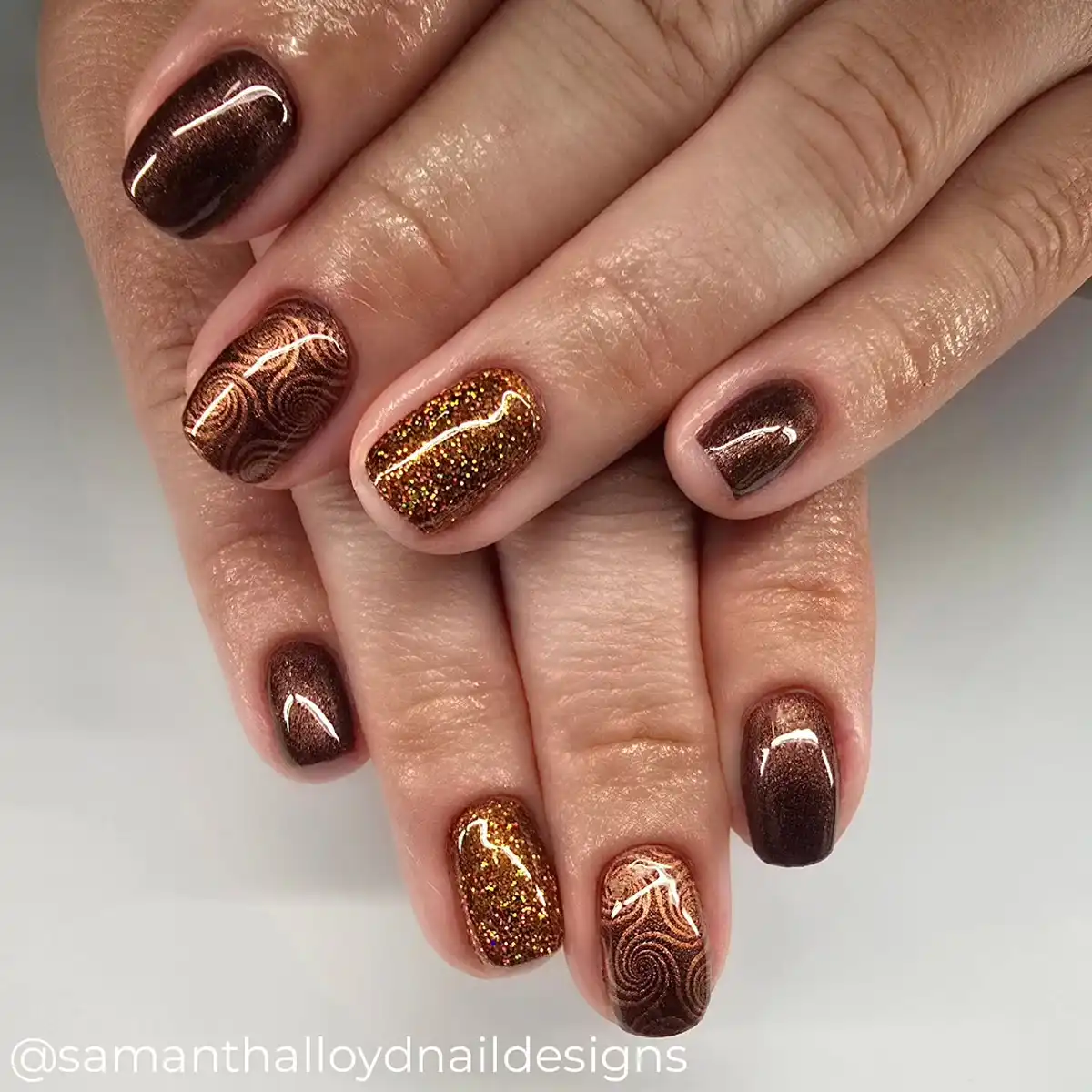 Short brown shimmer with copper swirls and gold glitter accent