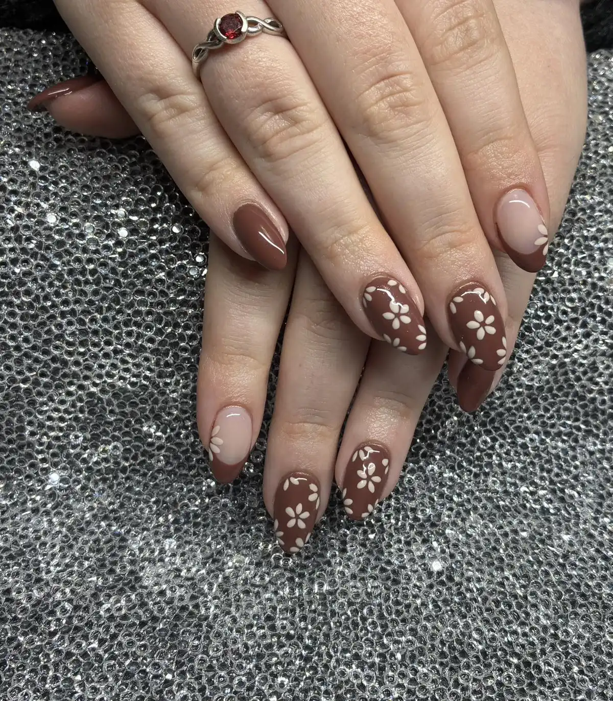 Brown floral manicure with nude-and-brown French tip variations