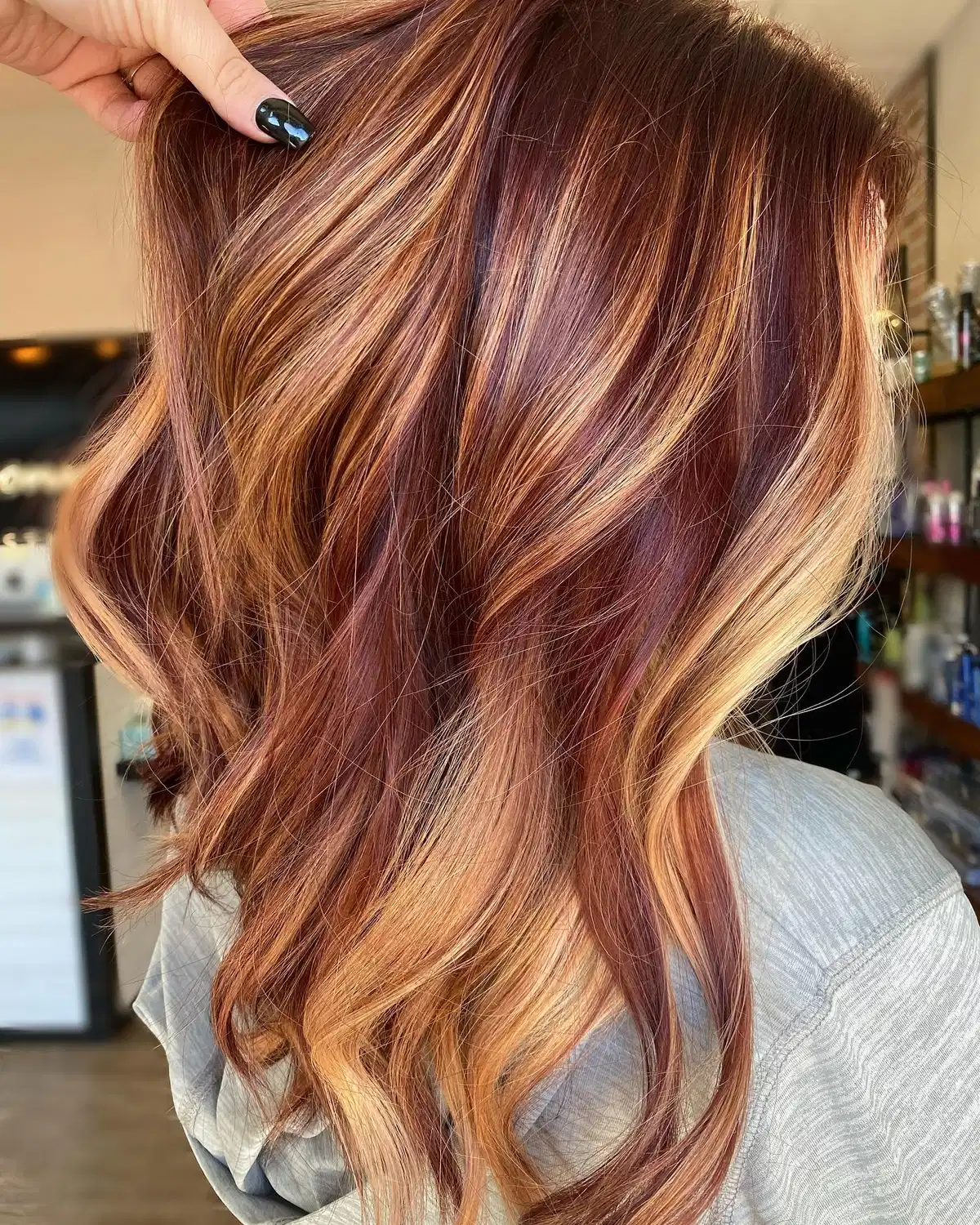 Reddish-brown hair with copper and blonde streaks