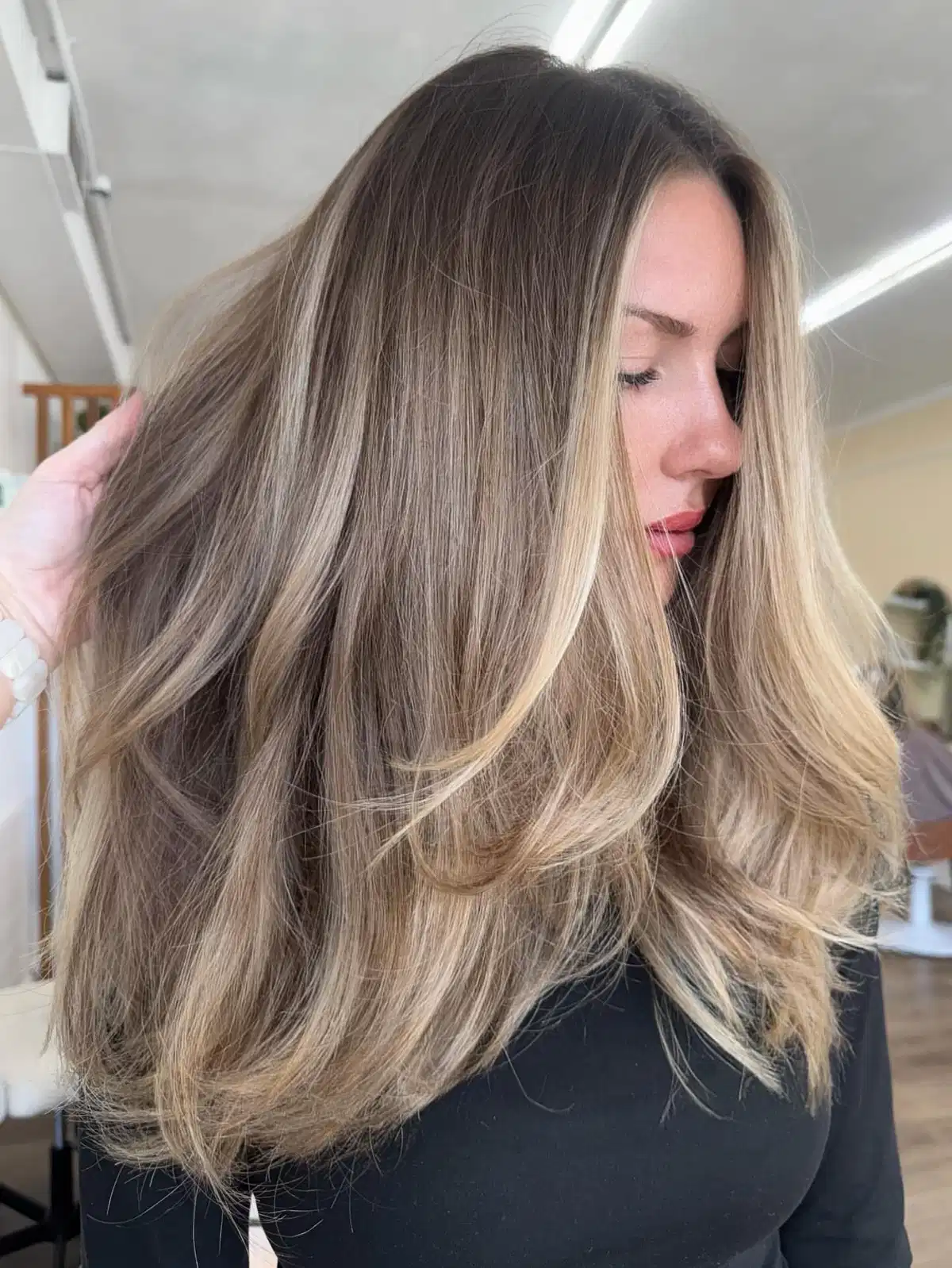 Rooted blonde with bright face-framing pieces