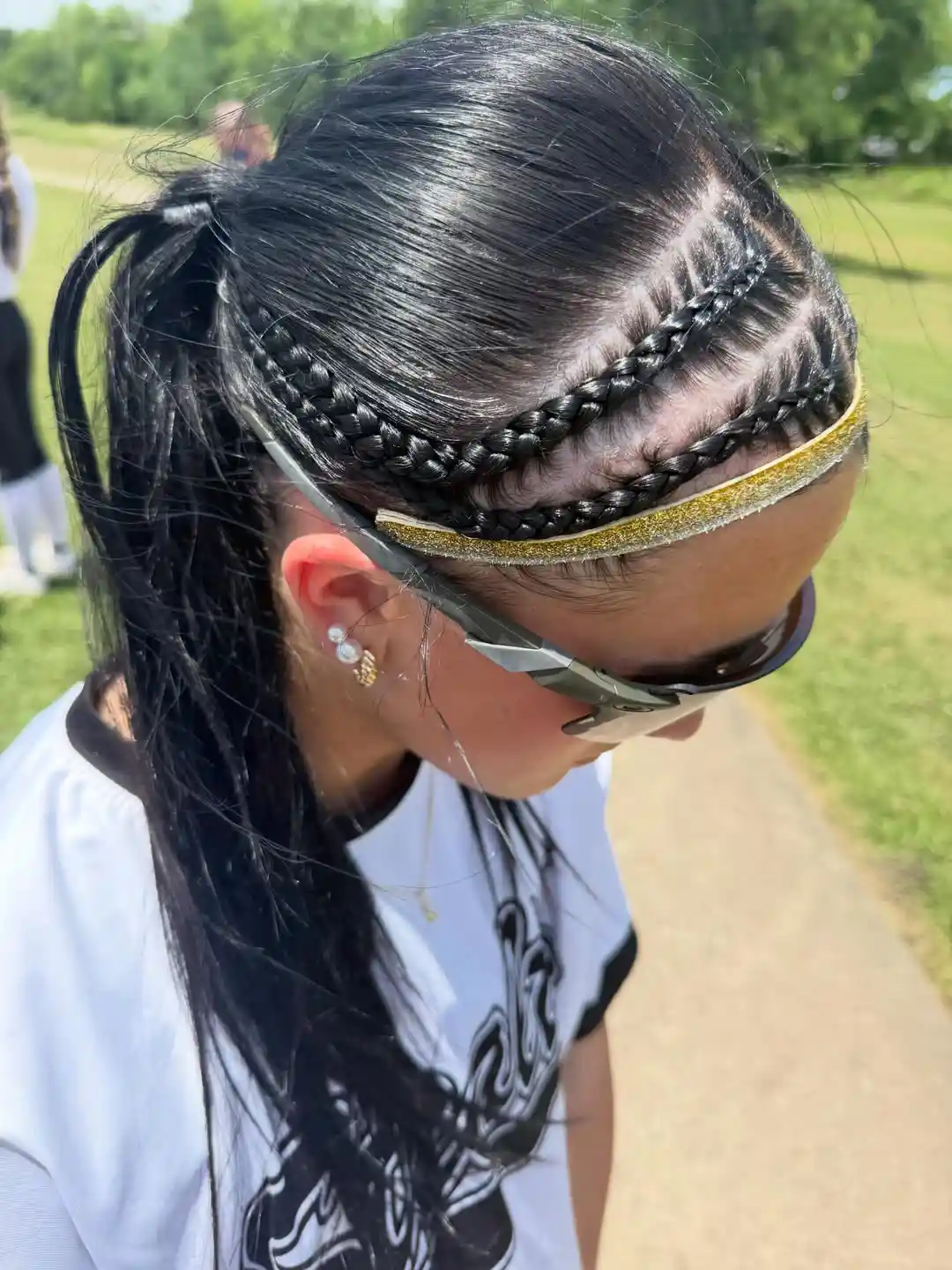 Double front braids with gold headband and ponytail