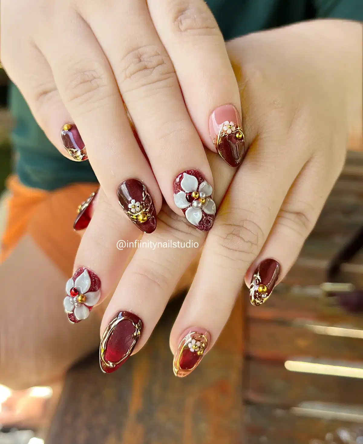 Gold-outlined maroon and white florals with bead accents