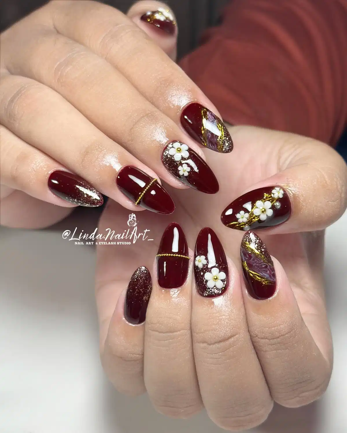 Maroon florals with gold lines and glitter tips