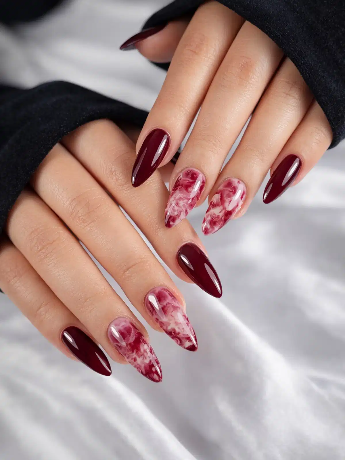 Deep maroon stilettos with pink-white marbled accents