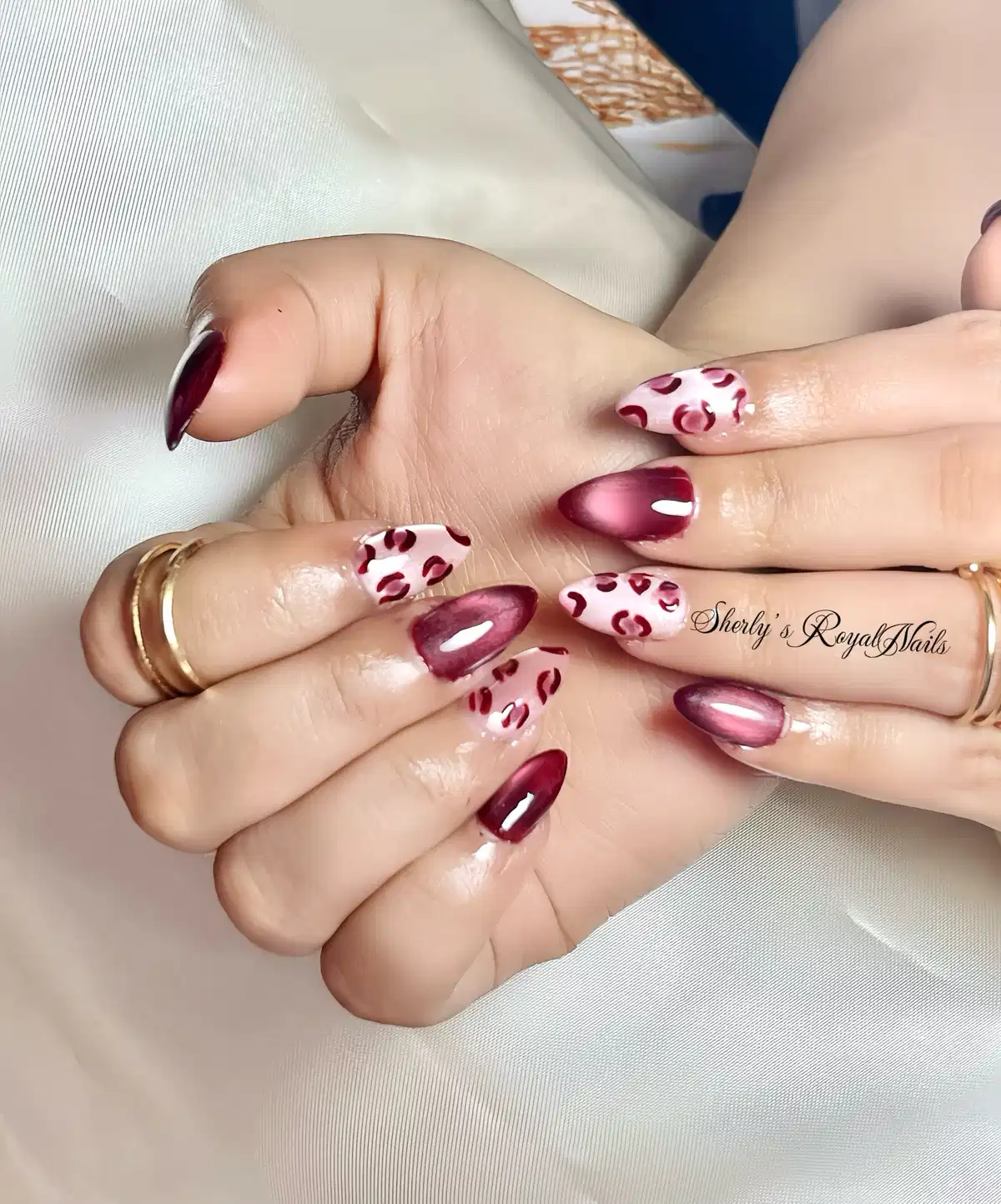 Maroon cat-eye with pink-and-maroon spot accents