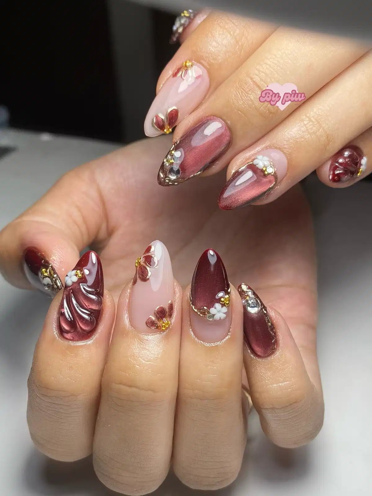 Nude and maroon mix with raised floral embellishments