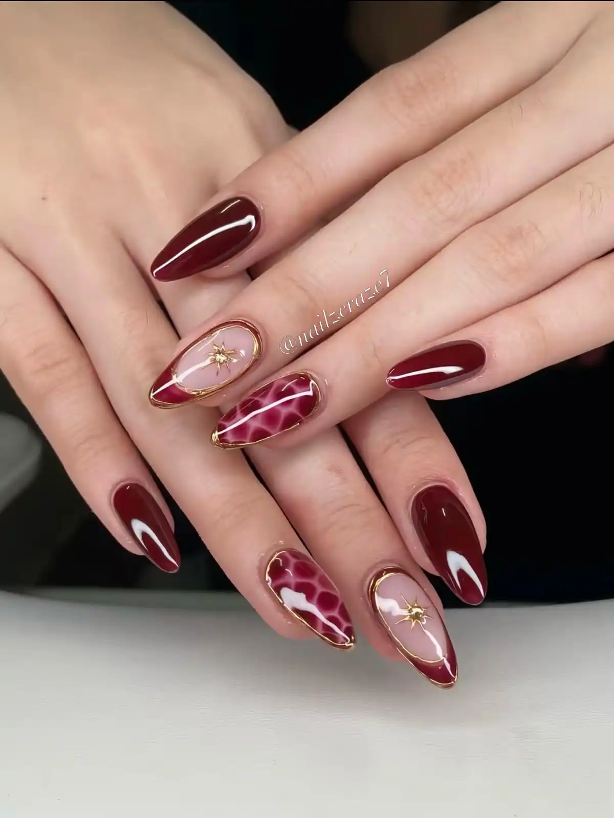Gold-Outlined Maroon Tips with Starburst and Pattern Accents