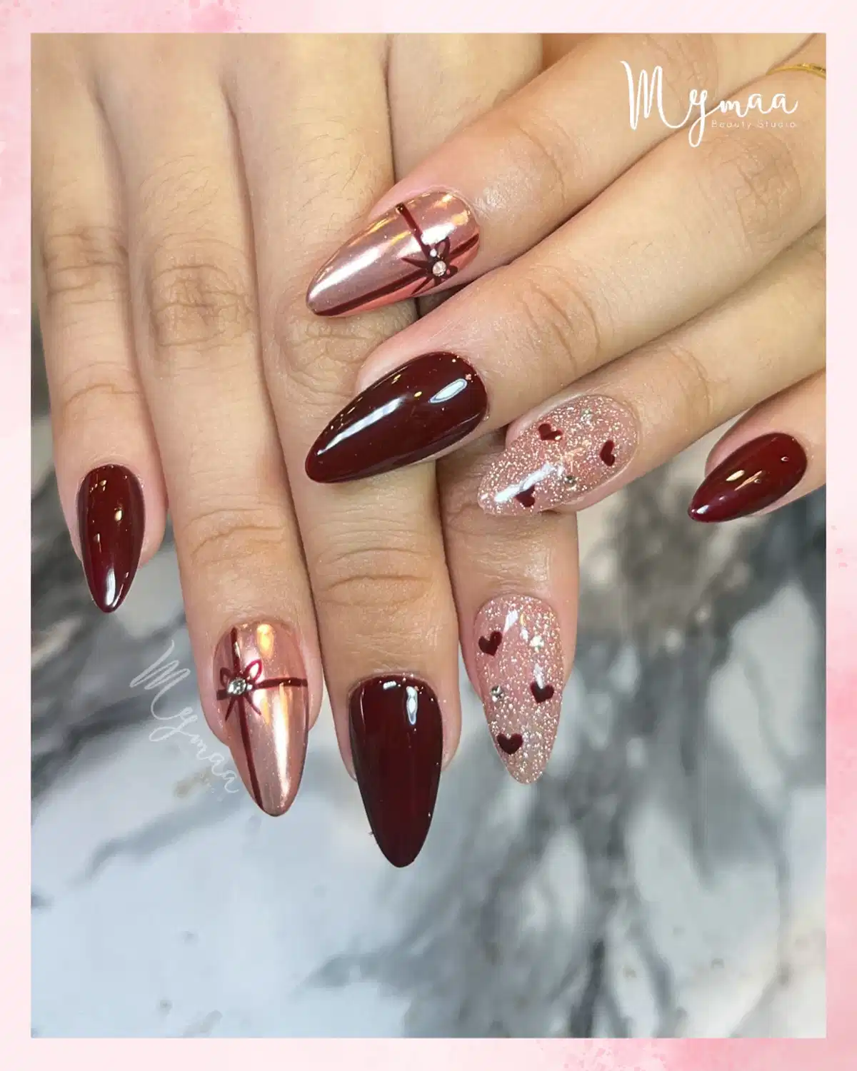 Maroon solids with rose-gold ribbon accents and heart glitter nails