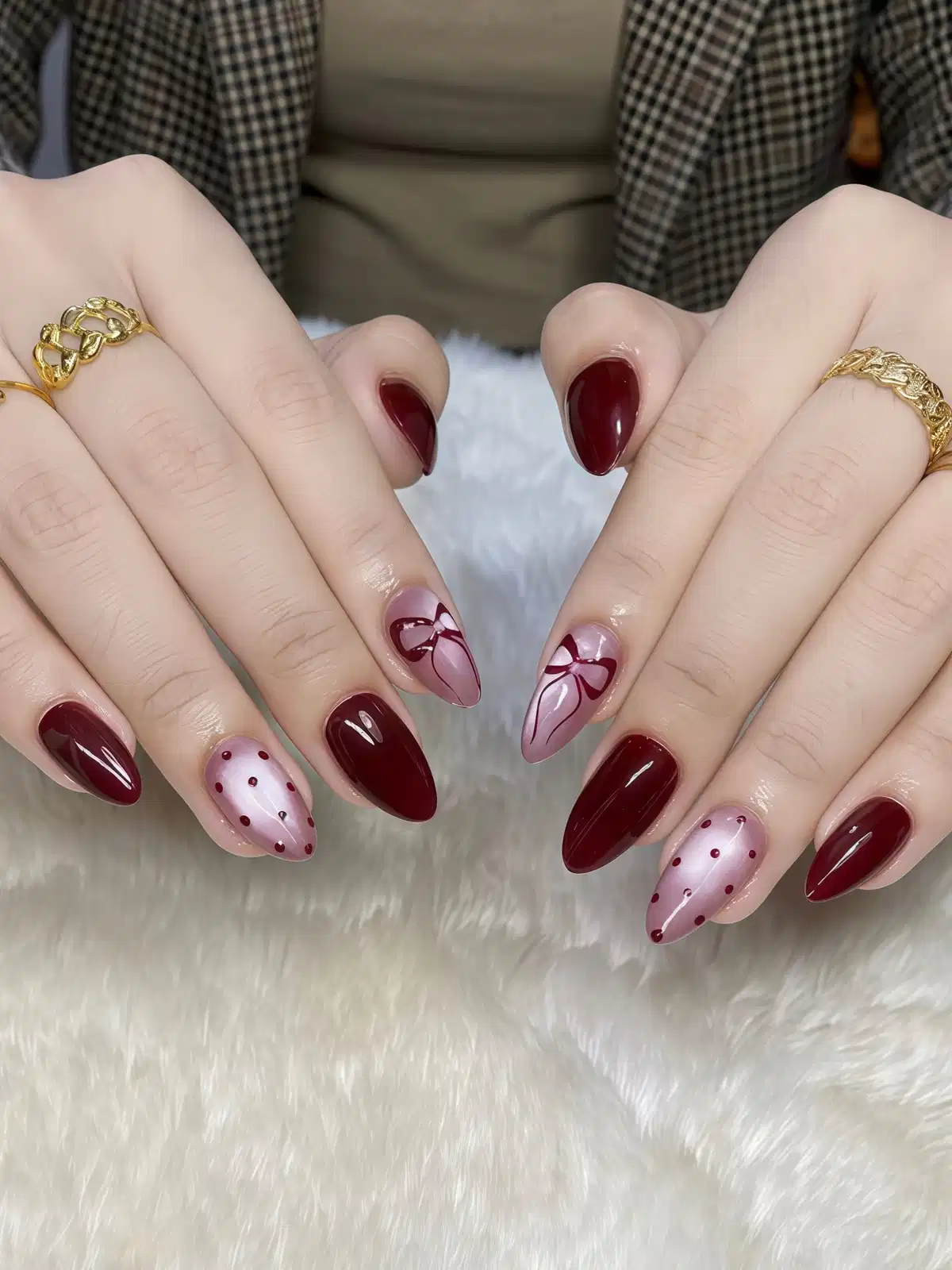 Deep maroon solids with dotted nude accents and bow art