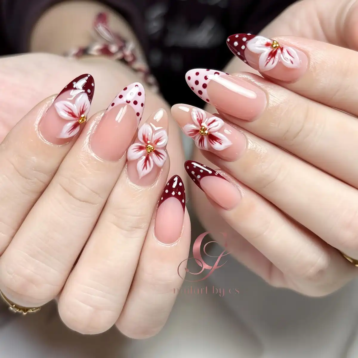 Maroon polka-dot tips with white floral accents and gold centers