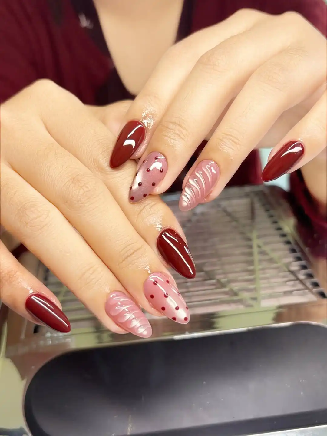 Maroon solids with polka-dot accents and raised wavy texture